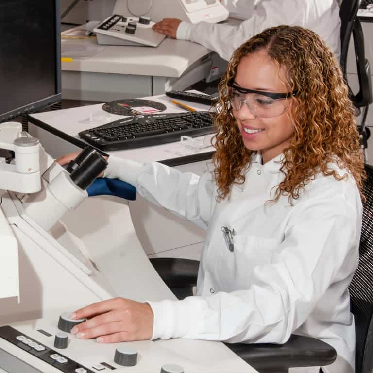 Smiling woman performing Laboratory Testing